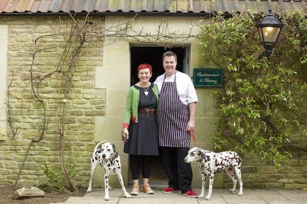 The Pear Tree Inn's new custodians - landlord Jackie Cosens and chef Adrian Jenkins, with their dalmatians